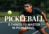 Pickleball: 5 Things to Master in Pickleball for Better Play Filipino/Asian pickleball player in action on outdoor court during match